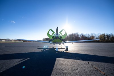 Lime green and white Cirrus SR-series aircraft detail, image N294GG-002.