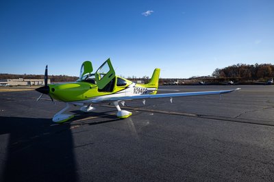 Lime green and white Cirrus SR-series aircraft detail, image N294GG-004.