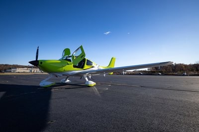 Lime green and white Cirrus SR-series aircraft detail, image N294GG-006.