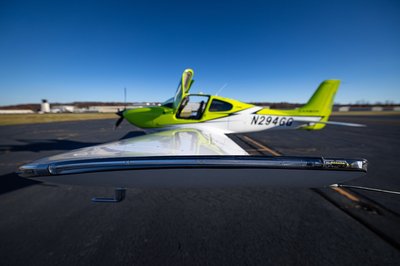 Lime green and white Cirrus SR-series aircraft detail, image N294GG-009.