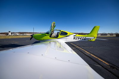 Lime green and white Cirrus SR-series aircraft detail, image N294GG-010.