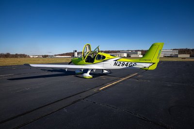 Lime green and white Cirrus SR-series aircraft detail, image N294GG-011.