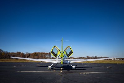 Lime green and white Cirrus SR-series aircraft detail, image N294GG-014.