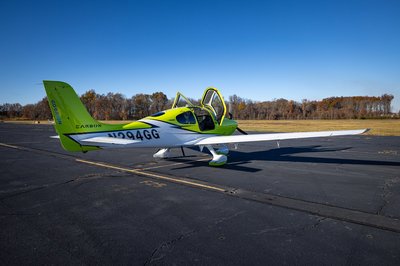 Lime green and white Cirrus SR-series aircraft detail, image N294GG-015.