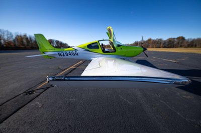 Lime green and white Cirrus SR-series aircraft detail, image N294GG-020.