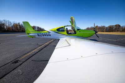 Lime green and white Cirrus SR-series aircraft detail, image N294GG-021.
