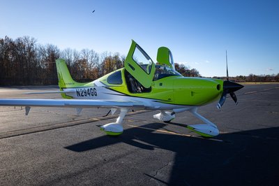 Lime green and white Cirrus SR-series aircraft detail, image N294GG-023.