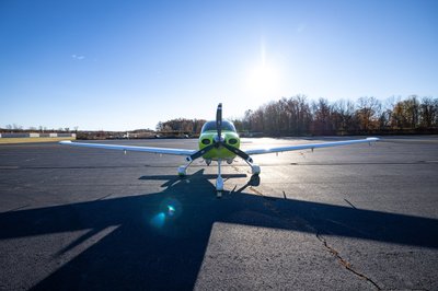 Lime green and white Cirrus SR-series aircraft detail, image N294GG-027.