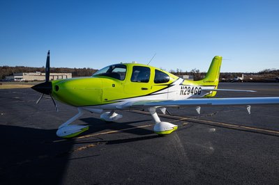 Lime green and white Cirrus SR-series aircraft detail, image N294GG-031.