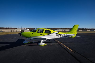 Lime green and white Cirrus SR-series aircraft detail, image N294GG-033.