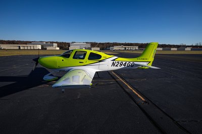 Lime green and white Cirrus SR-series aircraft detail, image N294GG-034.