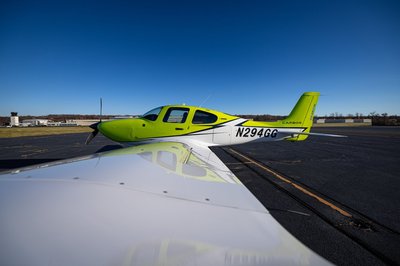 Lime green and white Cirrus SR-series aircraft detail, image N294GG-036.