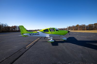 Lime green and white Cirrus SR-series aircraft detail, image N294GG-043.