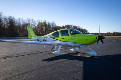 Lime green and white Cirrus SR-series aircraft detail, image N294GG-048.