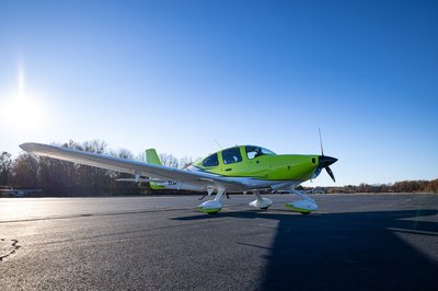 Lime green and white Cirrus SR-series aircraft detail, image N294GG-049.