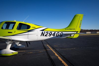 Lime green and white Cirrus SR-series aircraft detail, image N294GG-052.