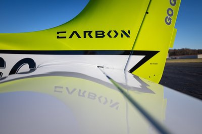 Lime green and white Cirrus SR-series aircraft detail, image N294GG-054.