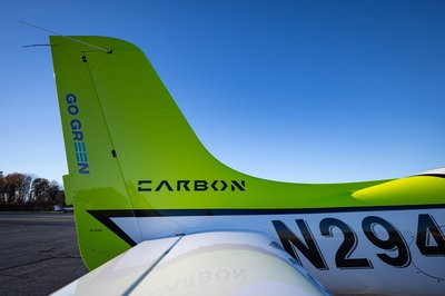Lime green and white Cirrus SR-series aircraft detail, image N294GG-056.
