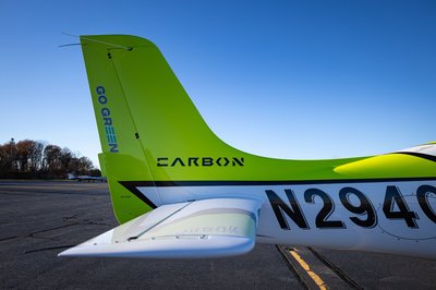Lime green and white Cirrus SR-series aircraft detail, image N294GG-057.