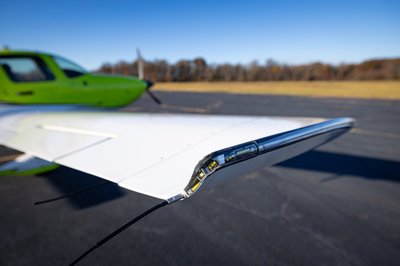 Lime green and white Cirrus SR-series aircraft detail, image N294GG-059.