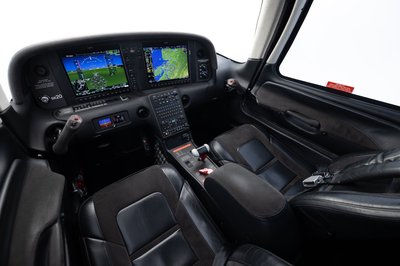 Lime green and white Cirrus SR-series aircraft detail, image N294GG-068.