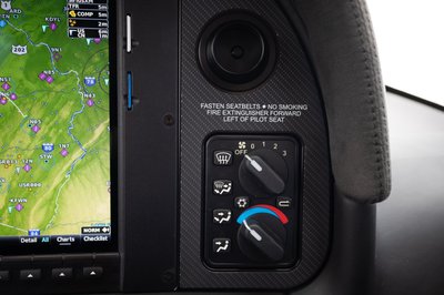 Lime green and white Cirrus SR-series aircraft detail, image N294GG-081.