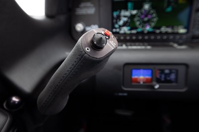 Lime green and white Cirrus SR-series aircraft detail, image N294GG-086.